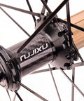 Close-up of carbon hub on 700C Road Bike Wheelset With Aluminum Rim And Carbon Hub, V Brake Quick Release For 7 To 11 Speed Cassettes.
