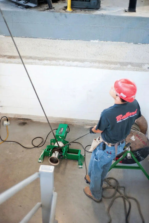 Electrician using Puller Assembly UT10 2S for durable cable pulling and conduit installations on job site