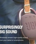 Clip 4 Portable Mini Bluetooth Speaker with Carabiner IP67 Waterproof attached to bag showcasing sound quality features.