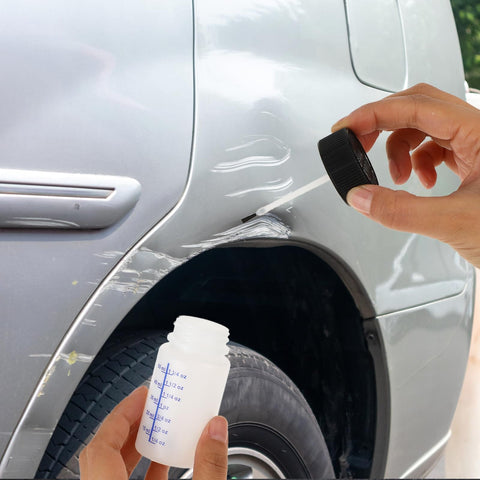 Applying paint with 6 Pack Empty Touch Up Paint Bottles 2 Oz Refillable Containers With Brush Applicator for car scratch repair.
