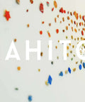 Colorful wave of small dots in rainbow hues on white background with "MAHITOI" text overlay.