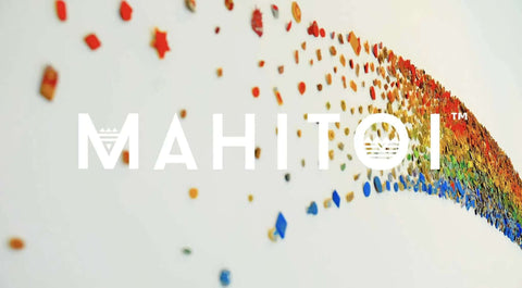 Colorful wave of small dots in rainbow hues on white background with "MAHITOI" text overlay.