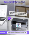 Wireless 4x6 Bluetooth Thermal Label Printer For Small Business And Shipping Print From IPhone Android Windows MacOS Easy App Connectivity For Amazon FBA And Shopify Orders Compact Desk Friendly connected via USB to laptop, printing a label.
