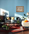 Living room with Vintage Rowing Boat Ocean Journey Poster Canvas Print For Living Room Decor And Bedroom Wall Art on blue wall