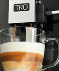 Close-up of Top Notch Automatic Espresso And Coffee Machine With Built In Grinder brewing a latte with layered colors.