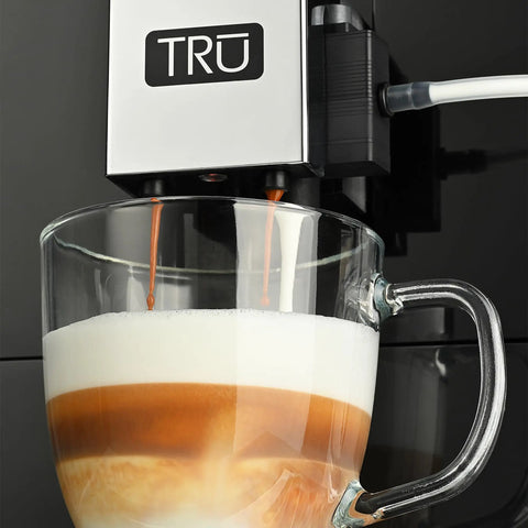 Close-up of Top Notch Automatic Espresso And Coffee Machine With Built In Grinder brewing a latte with layered colors.