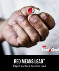 Hand holding red-tipped Instant Lead Test Swabs Eight Pack Kit With Disposable Swabs For Surface Screening, Detect Lead In 30 Seconds