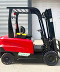 2.5 Ton Forklift Truck With Ergonomic Operator Cabin For Warehouse Material Handling, Hydraulic Cargo Lifting Equipment For Easy Pallet Transport And Beefy Heavy Duty Load Shifting. Red electric forklift side view with hydraulic mast