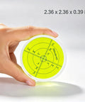 Magnetic Round Bubble Level Tool Bullseye Inclinometer Machinist held in hand, displaying yellow measurement grid.