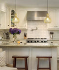 Gold Pendant Light Fixture With Adjustable Rope For E26 Bulbs, Industrial Hanging Pendant Lamp in a modern kitchen setting.