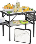 Compact Foldable Camping Table Two Foot For Picnic Portable Beach Table with Side Racks and Net, aluminum frame with snacks.