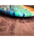Close-up of a vibrant blue and orange 15-inch hand painted lazy Susan that spins 360 degrees for dining tables and kitchen counters.