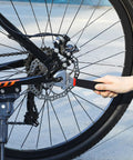 Adjusting bike wheel with wrench from 95 Piece Diy Tool Set With Portable Plastic Toolbox And Adjustable Wrench Pliers Socket Bits For Home Garage And Apartment Repairs Everyday Fixes Grab And Go