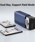 Top Rack Dual Sata Hard Drive Enclosure With Raid Disk Array And Quiet Cooling Fan USB3.0 next to two SATA drives.