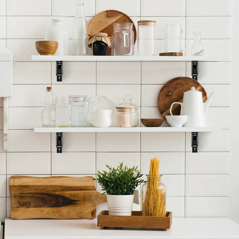 Rugged Matte Black Folding Shelf Brackets, 12 Inch Wall Mounted Hardware For Garage And Workshop supporting white shelves with kitchen items.