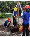 Heavy Duty Confined Space Tripod Rescue Kit With Fall Protection And Industrial Lifting System in use at a worksite.
