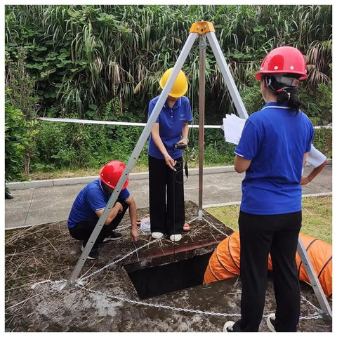 Heavy Duty Confined Space Tripod Rescue Kit With Fall Protection And Industrial Lifting System in use at a worksite.