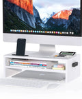 Wooden Monitor Stand Riser With Two Tier Desk Shelf And Cable Management Phone Holder And Eco Friendly White Finish Ergonomic Computer Desk Organizer To Reduce Strain For Home Office And Workstation 16.5 Inch holding a computer monitor, phone, books, and organizer items.