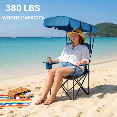 Person on Heavy Duty Oversized Portable Canopy Camping Chair With Sunshade 380 Lb Capacity Folding Lawn Chair at beach
