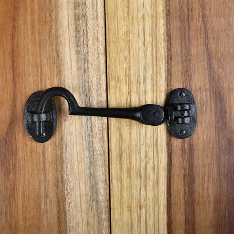 Heavy Duty 4.5 Inch Black Wrought Iron Swivel Style Hook And Eye Door Latch with Mounting Hardware on Wooden Door