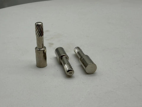 Three electrodes from Pro Grade Plasma Consumables Kit For Thermal Dynamics Torch PCH 25 38 M28 M35 M40 on white surface.