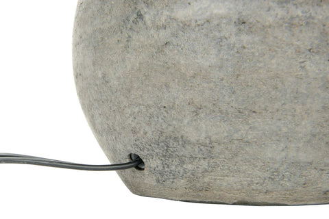 Close-up of Round Terracotta Table Lamp With Canvas Shade In Distressed Grey Finish, showing cable outlet in terracotta base.
