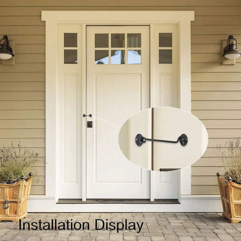 Installation display of Stainless Steel Gate Hook and Eye Latch for Cabinet Door Window Shed Barn on a front door.