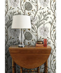 Straight Up Stunning Jumbo Floral Neutral Wallpaper With Matte Linen Texture And Durable Pvc Free Build Zero Hassle Paste To Paper Install For Kitchens Bathrooms And Commercial Spaces, showcased with lamp and wooden table.