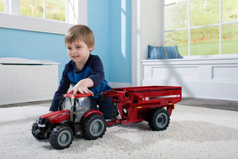 Child playing with Big Farm Tractor Toy For Kids With Realistic Lights And Sounds Opening Hood Removable Front Weights Three Point Hitch
