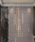 Rectangular pendant lights in a modern room with marble and wood accents