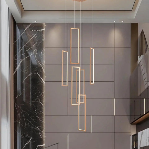 Rectangular pendant lights in a modern room with marble and wood accents