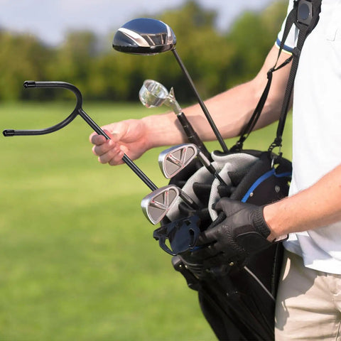 Golfer using U Shaped Golf Club Holder Set Two Pack That Keeps Your Clubs Clean Dry And Visible Detachable Metal Stand Durable Golf Club Rack For Easy Carry On The Course And Protect Your Bag On The Go on the course.