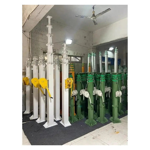Heavy Duty Self Standing Hand Crank Lifting Mast With Slick Telescopic Design Adjustable Height Portable Work Platform For Construction Maintenance Zero Sweat Operation And Built Tough in a storage area.