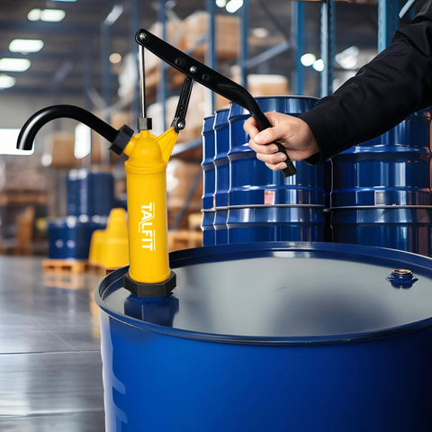 TALFIT lever-action barrel pump installed on a blue 55-gallon drum; yellow pump with black lever and spout