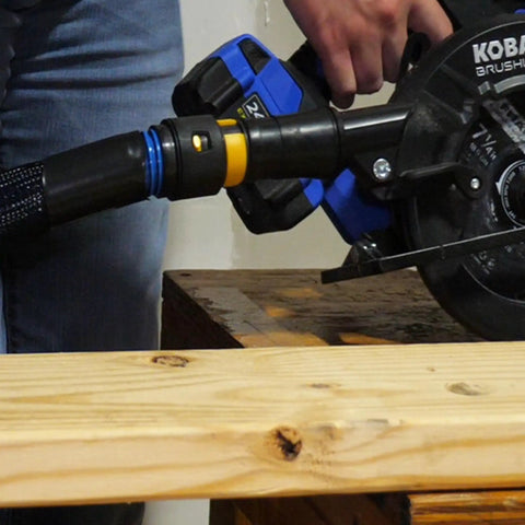 Antistatic Expanded Multi Brand Power Tool Dust Collection Adapter Set With Quick Click System connected to saw
