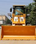 Front view of 4WD Compact Backhoe Loader With 2.2m Digging Depth And Multi Attachments Workhorse Ready Builder Grade Construction Equipment Customizable Configs For Contractors And Land Developers on a sunny day.