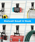 Gladiator Style Slatwall Hooks 10 Pack Heavy Duty Garage Hangers for Tools and Garden Hose Durable Metal Wall Mounts with Anti Skid Cushioned Rubber, Easy One Step Mount Proslat and Flow Wall Compatible, shown holding various items on white slatwall.