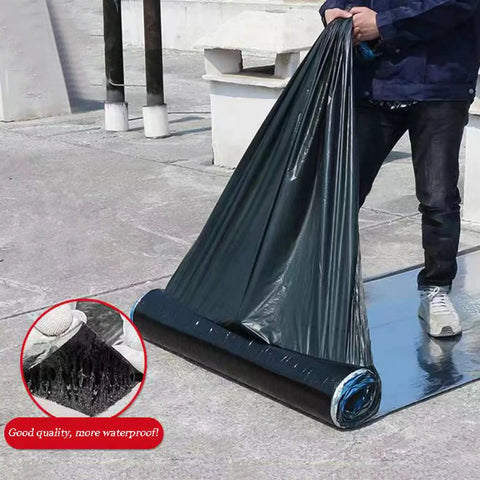 Hella Tough Self Adhesive Roofing Felt Roll With Butyl Asphalt Waterproof Tape and Heavy Duty Aluminum Foil backing being unrolled by a worker.