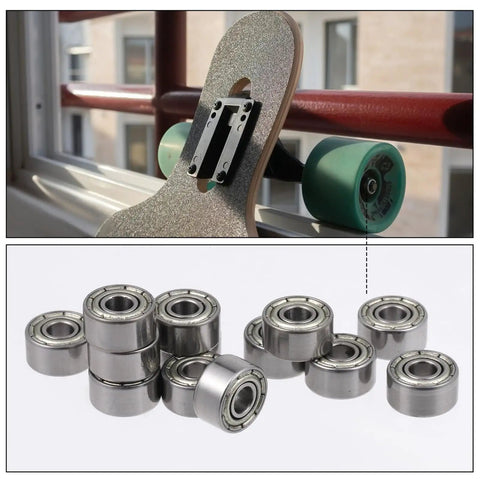 693ZZ Double Shielded Deep Groove Ball Bearings Kit 30Pcs High Speed Silent Miniature Carbon Steel Bearings For Skateboards And Bikes 3mm X 8mm X 4mm Precision Sizing For Diy Projects displayed with bearings and skateboard.
