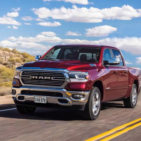 Ram 1500 DT truck on road, showcasing front view with curved bumper suitable for Front License Plate Frame For 2019 To 2024 Ram 1500 DT.