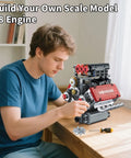 Person assembling Mini V8 Engine Kit That Runs Real Pistons And Moving Crankshaft 478 Piece STEM Engineering Model with tools on table
