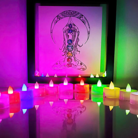 Color Changing LED Tea Lights 24 Pcs Flameless Tealight Candles with colorful lights in front of abstract art, white base, 7 color cycle