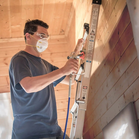 Heavy Duty Cart Airless Paint Sprayer For Interior And Exterior Jobs Featuring Stainless Steel Piston Pump in use on a ladder.
