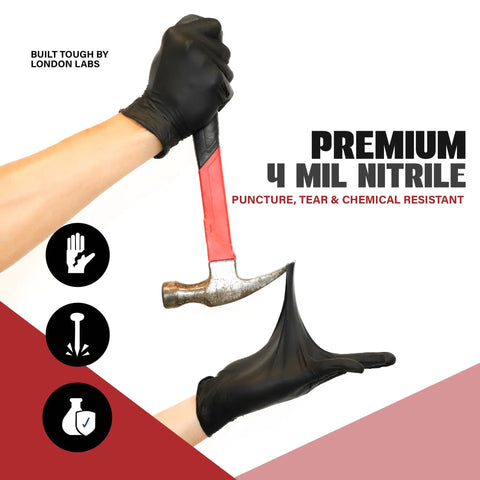Built To Last Heavy Duty Black Nitrile Exam Gloves 4 Mil Thick Disposable And Powder Free Chemical Resistant Workhorse For Medical Emt And Mechanic Jobs Bulk Case Of One Thousand Count showing durability with a hammer.