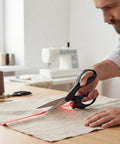 Man using Laser Guided Scissors for Fabric and Paper Cutting, Infrared Laser Line for Crisp Straight Cuts, Pro Grade Tool for Crafts
