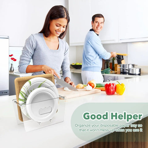 Space Saving Acrylic Paper Plate Dispenser For 5 To 12 Inch Plates on a kitchen counter with people cooking in background.