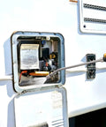 Rock Solid Rv Camper Rig Service Kit Featuring A Durable Mag Anode Rod And Flexible Flush Wand For Hot Water Tanks Paired With A Sturdy Hex Wrench For No Sweat Sediment Removal, using flush wand on water heater.