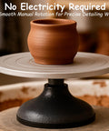 Front view of a 7-inch sculpting wheel turntable with all-metal construction and a clay pot on top.