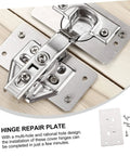 Close-up of Six Piece Cabinet Hinge Repair Plates Kit With Screws Durable Furniture Fixing Plates installed on wood surface.