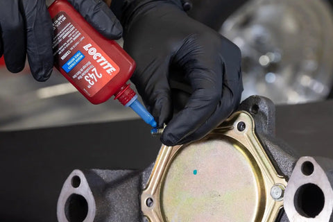 Applying Medium Strength Surface Insensitive Threadlocker For 1/4 To 3/4 Inch Fasteners on a screw in automotive use